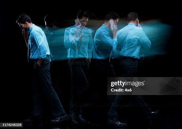 full length / one man only / one person / side view / profile view of 30-39 years old adult handsome people caucasian young men / male businessman / business person walking / multiple exposure / long exposure / blurred motion wearing a suit - multiple exposure movement stock pictures, royalty-free photos & images