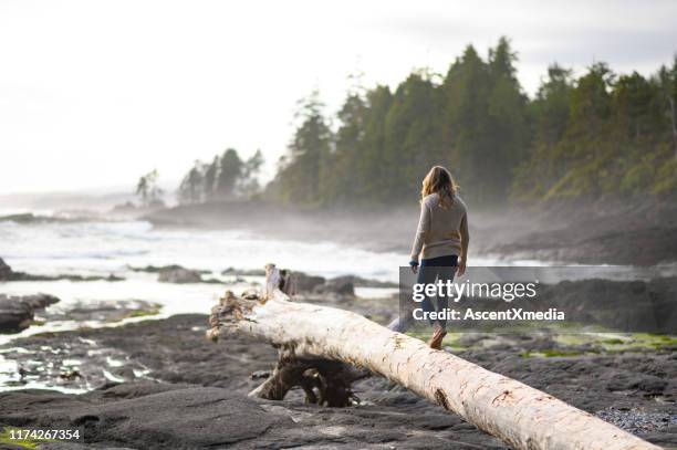 woman exploring nature - vancouver island stock pictures, royalty-free photos & images