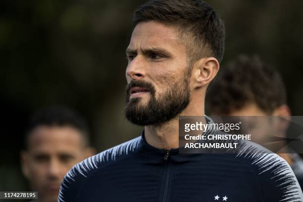 French national football team's forward Olivier Giroud arrives for a training session in Clairefontaine-en-Yvelines, southwest of Paris on October 7,...
