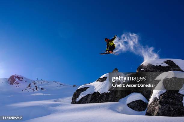 skier jumping into fresh powder - jumping sun stock pictures, royalty-free photos & images