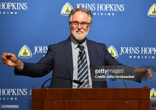 Dr. Gregg L. Semenza M.D., Ph.D addresses the media and a large crowd from Johns Hopkins Hospital at a press conference after learning he won the...