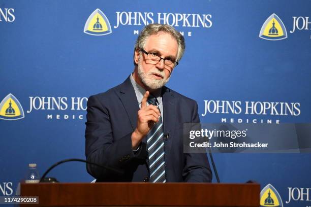 Dr. Gregg L. Semenza M.D., Ph.D addresses the media and a large crowd from Johns Hopkins Hospital at a press conference after learning he won the...