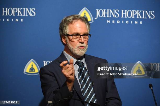 Dr. Gregg L. Semenza M.D., Ph.D addresses the media and a large crowd from Johns Hopkins Hospital at a press conference after learning he won the...