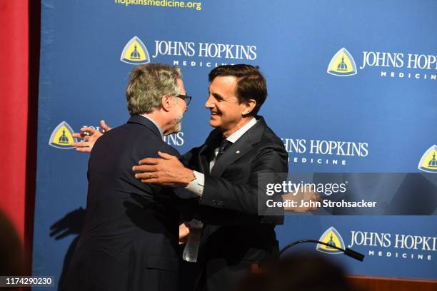 Dr. Gregg L. Semenza M.D., Ph.D is congratulated by Johns Hopkins president Ronald Joel Daniels at a press conference after learning he won the Nobel...