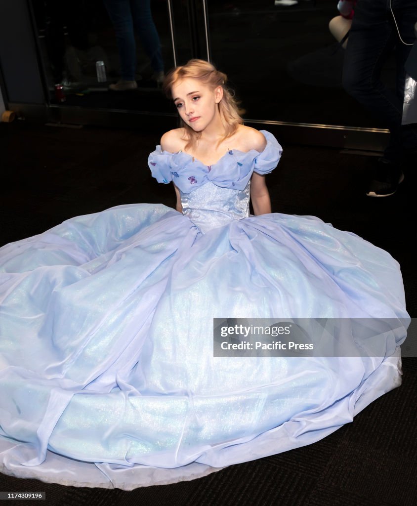 Comic Con attendee poses in the costumes during Comic Con...