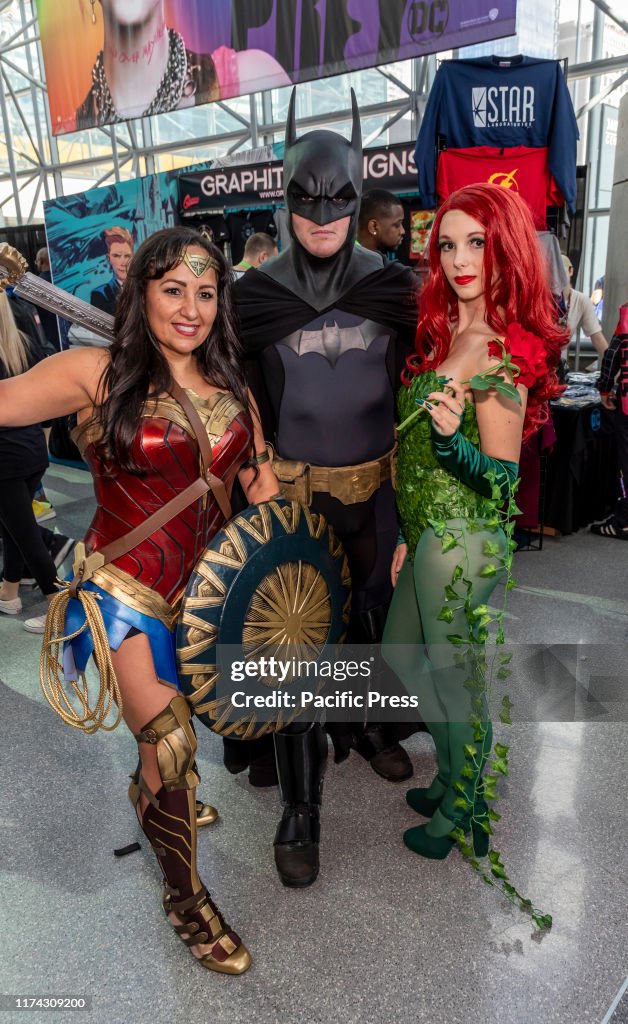 Comic Con attendees pose in the costumes during Comic Con...