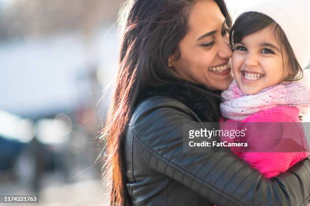 smiling muslim mother and child - egyptian family stock pictures, royalty-free photos & images