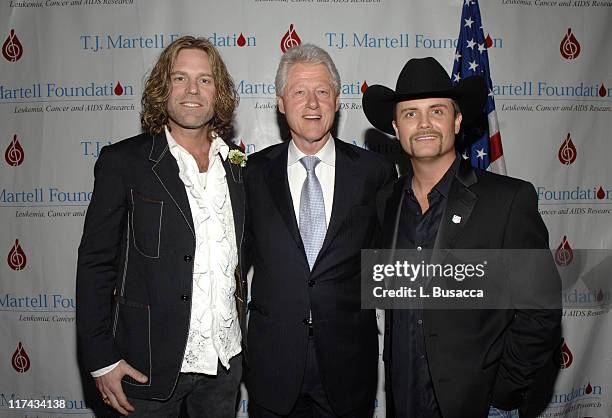 Former President Bill Clinton , with Big Kenny Alphin of Big & Rich , and John Rich of Big & Rich , at the T.J. Martell Foundation's 31st Annual...