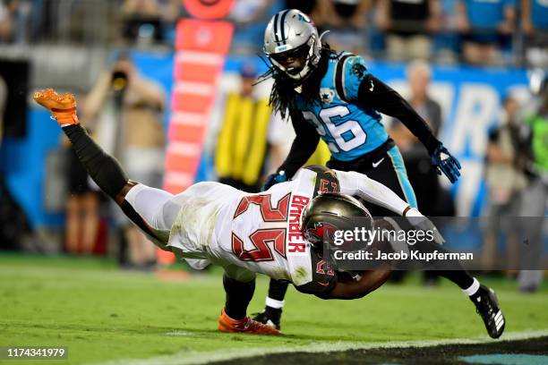 Peyton Barber of the Tampa Bay Buccaneers scores a touchdown in the third quarter during their game against the Carolina Panthers at Bank of America...