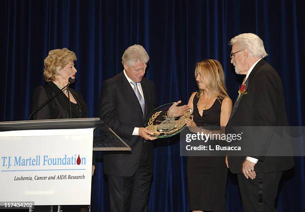 Frances Preston, President of the T.J. Martell Foundation, Sheryl Crow and Tony Martell, Chairman and Founder of the T.J. Martell Foundation present...