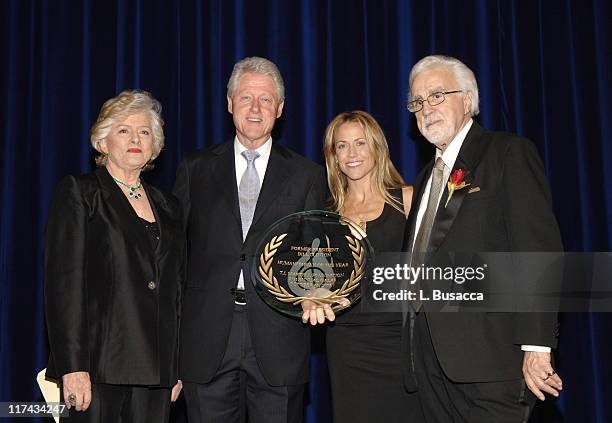 Frances Preston, President of the T.J. Martell Foundation, Sheryl Crow and Tony Martell present Former President Bill Clinton with the Humanitarian...
