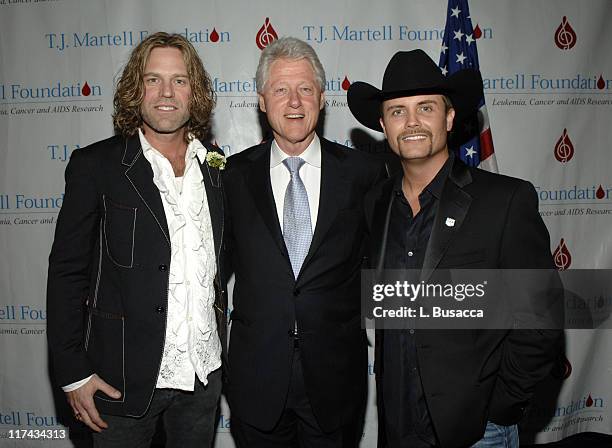 Former President Bill Clinton , with Big Kenny Alphin of Big & Rich , and John Rich of Big & Rich , at the T.J. Martell Foundation's 31st Annual...