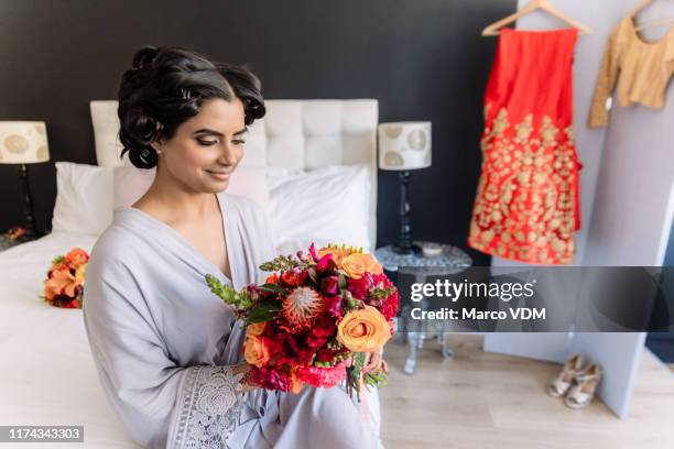 an elegant day needs elegant flowers - indian bridal makeup stock pictures, royalty-free photos & images