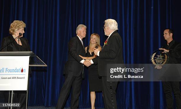 Frances Preston, President of the T.J. Martell Foundation, Sheryl Crow and Tony Martell, Chairman and Founder of the T.J. Martell Foundation present...