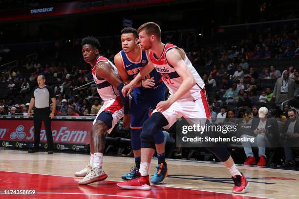 Davis Bertans of Washington Wizards and Kevin Knox of New York Knicks fights for position to grab the rebond during the preseason on October 7, 2019...
