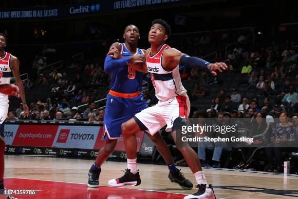 Barrett of New York Knicks and Rui Hachimura of Washington Wizards fights for position to grab the rebond during the preseason on October 7, 2019 at...