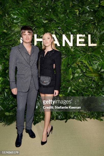 Joe Keery and Maika Monroe attend Chanel Dinner Celebrating Gabrielle Chanel Essence With Margot Robbie on September 12, 2019 in Los Angeles,...