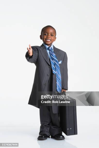 boy dressed as businessman - nachahmung erwachsener stock-fotos und bilder