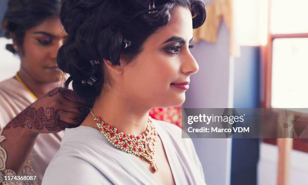 no one helps you look your best than your bridesmaid - indian bridal makeup stock pictures, royalty-free photos & images