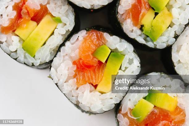 sushi with salmon and avocado - sushis stock pictures, royalty-free photos & images