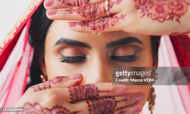 an important part of her culture - indian bridal makeup stock pictures, royalty-free photos & images