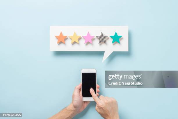 wooden five star shape with chat bubble and smart phone. - scoring system stock pictures, royalty-free photos & images