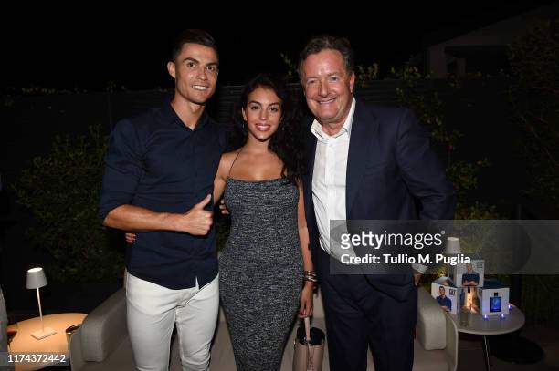 Cristiano Ronaldo, Georgina Rodriguez and Piers Morgan celebrate the launch of new CR7 Play It Cool with friends and family on September 12, 2019 in...