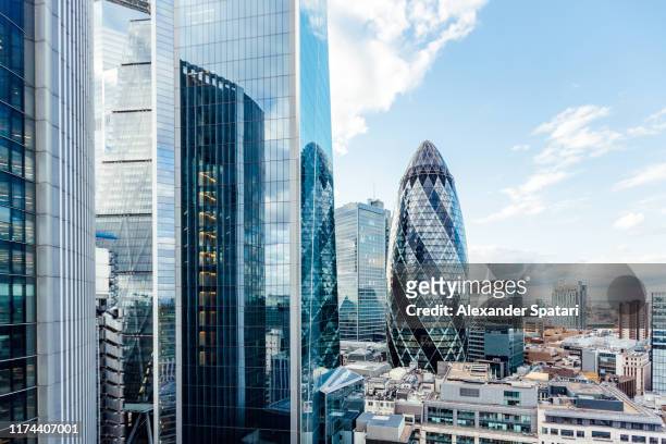 aerial view of skyscrapers in city of london, england, uk - aerial view london stock-fotos und bilder
