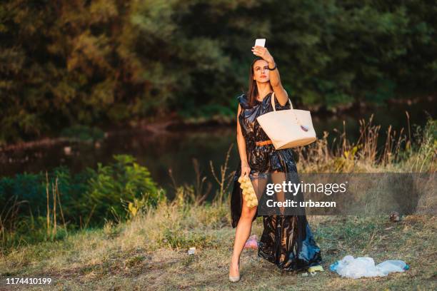 beauty and the trash - trash bag dress stock pictures, royalty-free photos & images