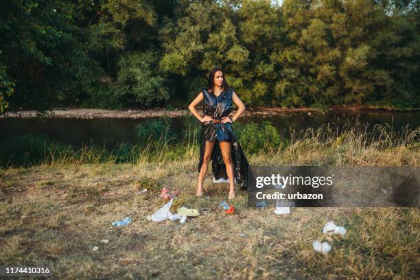 garbage heroine - trash bag dress stock pictures, royalty-free photos & images