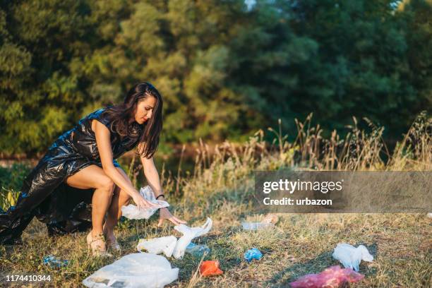 beauty and trash - trash bag dress stock pictures, royalty-free photos & images