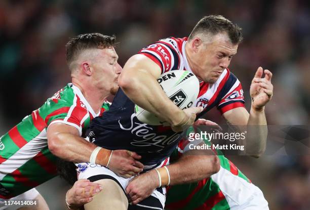 Brett Morris of the Roosters is tackled during the NRL Qualifying Final match between the Sydney Roosters and the South Sydney Rabbitohs at Sydney...