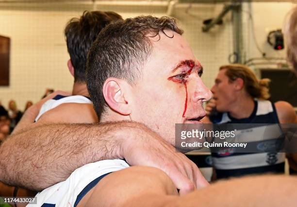 Joel Selwood,of the Cats sing the song in the rooms with his team mates after winning the AFL Semi Final match between the Geelong Cats and the West...
