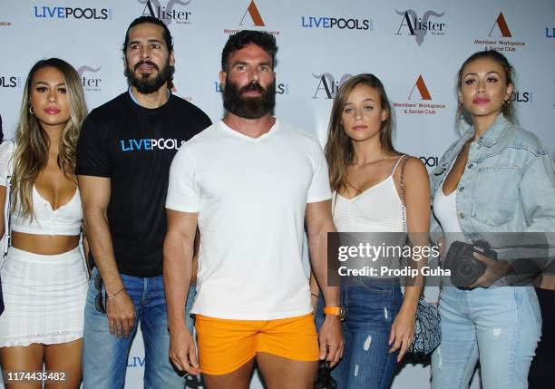 International personality Dan Bilzerian poses with models during a visit to India to announce his association with sports predictor LivePools and the...