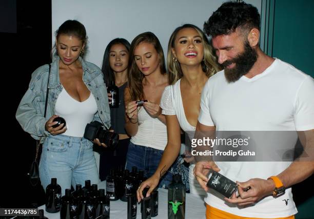 International personality Dan Bilzerian poses with models during a visit to India to announce his association with sports predictor LivePools and the...