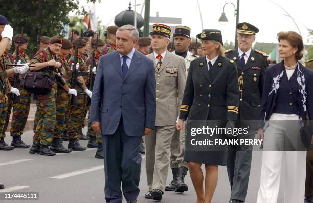 French Prime Minister Jean-Pierre Raffarin , Princess Astrid of Belgium and Princess Margaretha of Luxemburg inspect the troops, 05 June 2004 in...