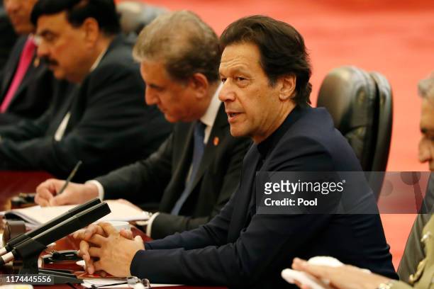 Pakistan's Prime Minister Imran Khan speaks during a meeting with Chinese Premier Li Keqiang at the Great Hall of the People in Beijing on October 8,...