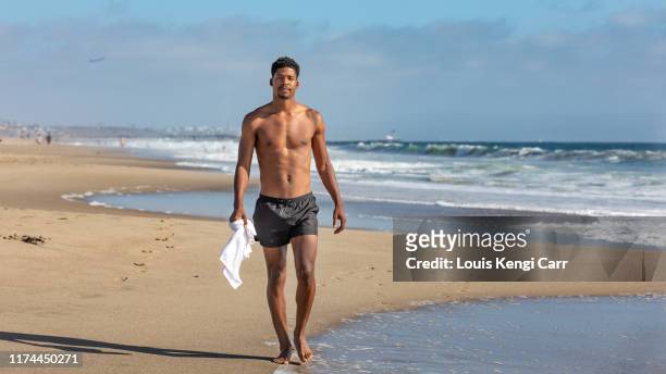 endless summer days - hunky guy on beach stock pictures, royalty-free photos & images