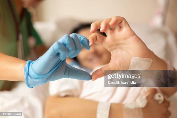 heart shape with doctor - hospital sign stock pictures, royalty-free photos & images