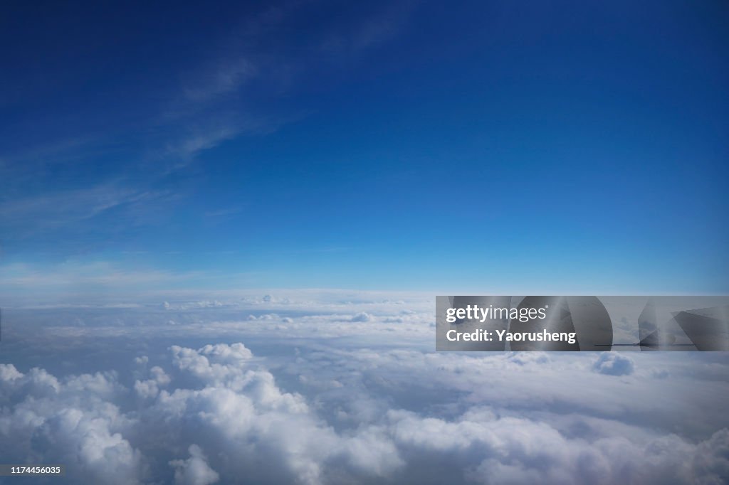 Cloudscape and stratosphere shot out of an airplane window