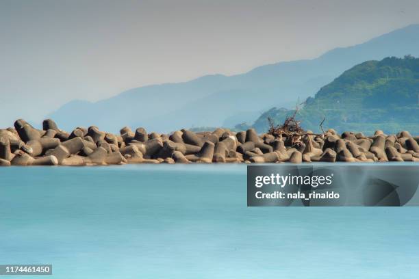 senami onsen beach, murakami, niigata, japan - groyne stock pictures, royalty-free photos & images