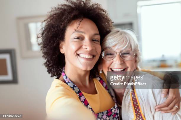 selfies with my mother - adoption child family stock pictures, royalty-free photos & images
