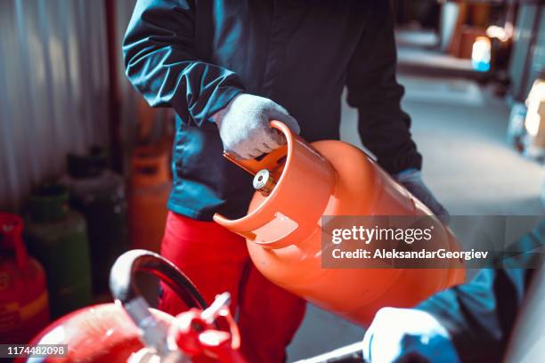 colleagues working in liquified gas store - canister stock pictures, royalty-free photos & images