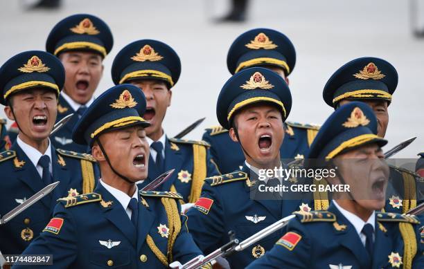 Members of a military honour guard parade during a welcome ceremony for Pakistani Prime Minister Imran Khan outside the Great Hall of the People in...