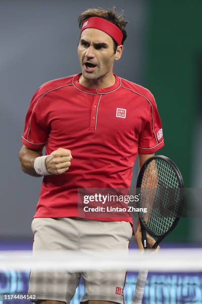 Roger Federer of Switzerland celebrates after defeating Albert Ramos-Vinolas of Spain on day four of 2019 Rolex Shanghai Masters at Qi Zhong Tennis...