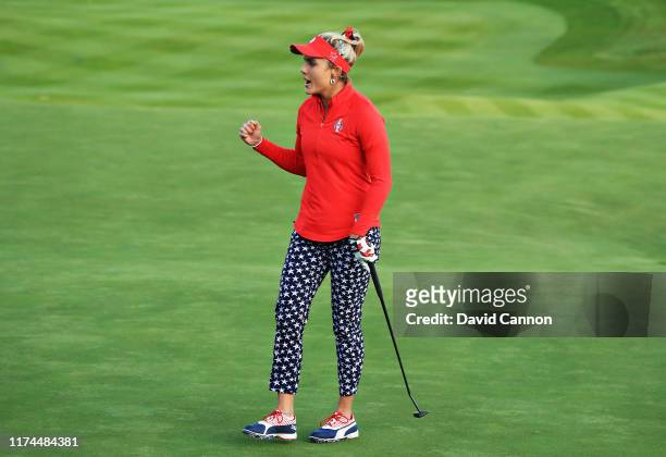 Lexi Thompson of Team USA reacts after her putt on the eighteenth green halved the match during Day 1 of The Solheim Cup at Gleneagles on September...