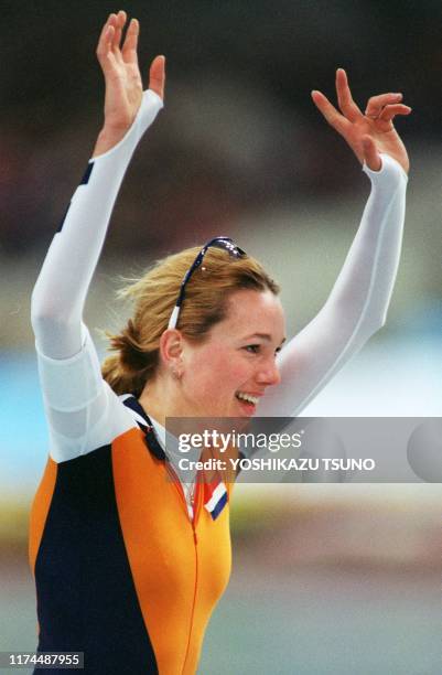 Marianne Timmer of the Netherlands celebrates her victory in the Olympic women's 1,000m event at the M-Wave in Nagano 19 February. Timmer, who won...