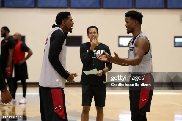 Udonis Haslem, and Jimmy Butler of the Miami Heat talk during Training Camp on October 3, 2019 at American Airlines Arena in Miami, Florida. NOTE TO...