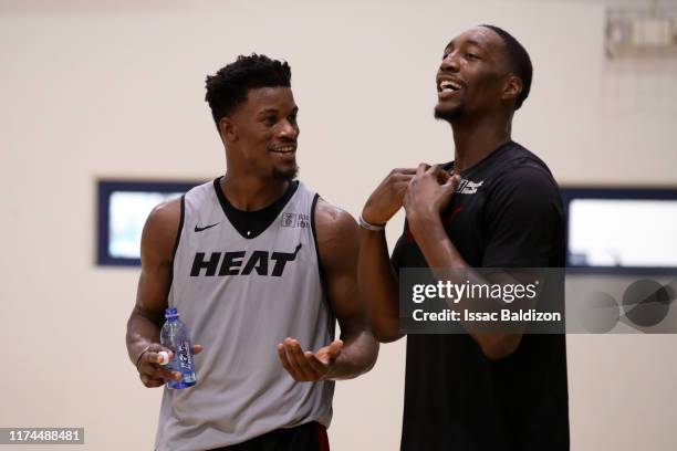 Jimmy Butler, and Bam Adebayo of the Miami Heat smiles during Training Camp on October 3, 2019 at American Airlines Arena in Miami, Florida. NOTE TO...