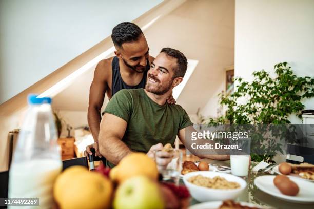 gay couple having healthy breakfast - hungary hotel stock pictures, royalty-free photos & images